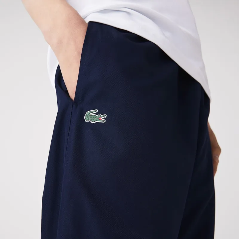 PANTALON DE SURVÊTEMENT UNI LACOSTE SPORT EN TISSU LEGER BLEU MARINE